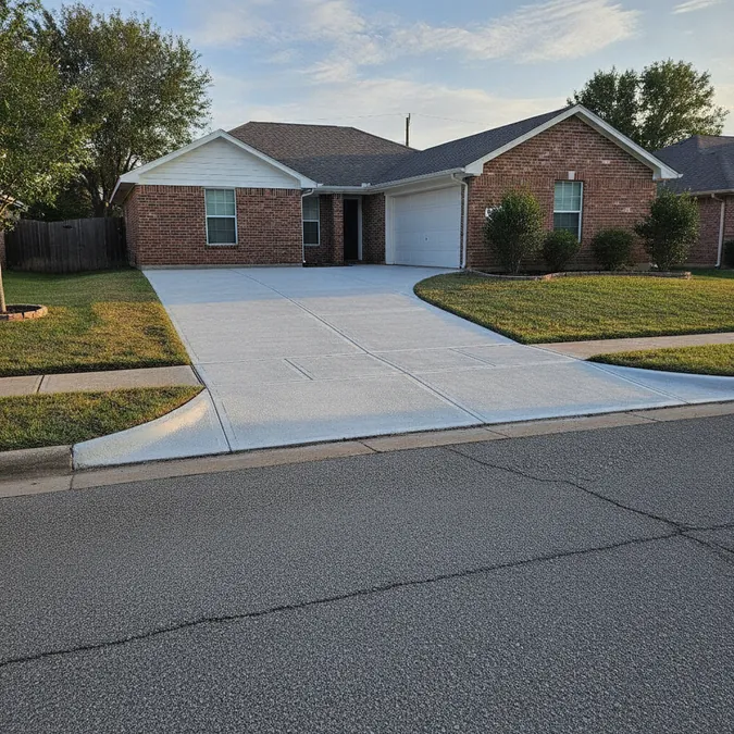 A finished resurfaced concrete patio has a clean textured surface and visible control joints.