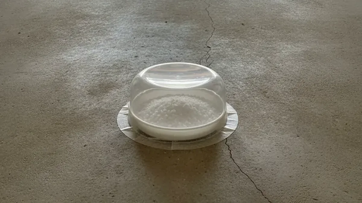 A moisture test is performed on a prepared concrete floor before an epoxy system is selected.