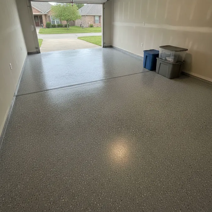 A finished garage floor coating creates a clean surface around parked vehicles and storage.